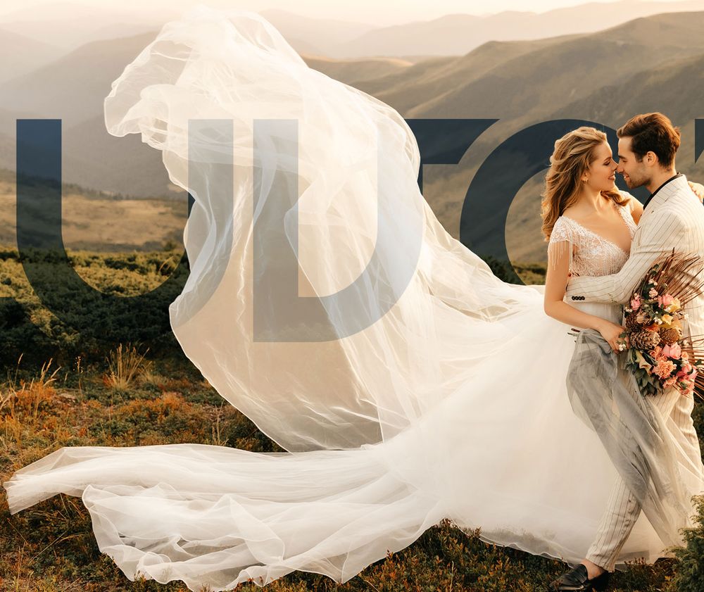 Noiva de vestido branco com o véu levantado pelo vento